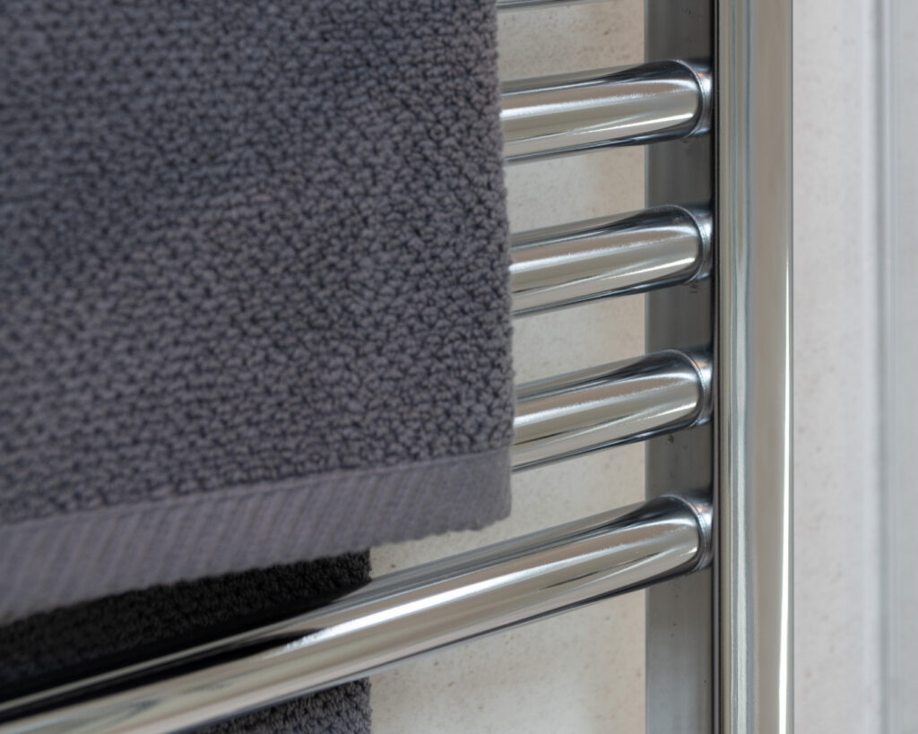 Towels hanging on a chrome heated towel rail